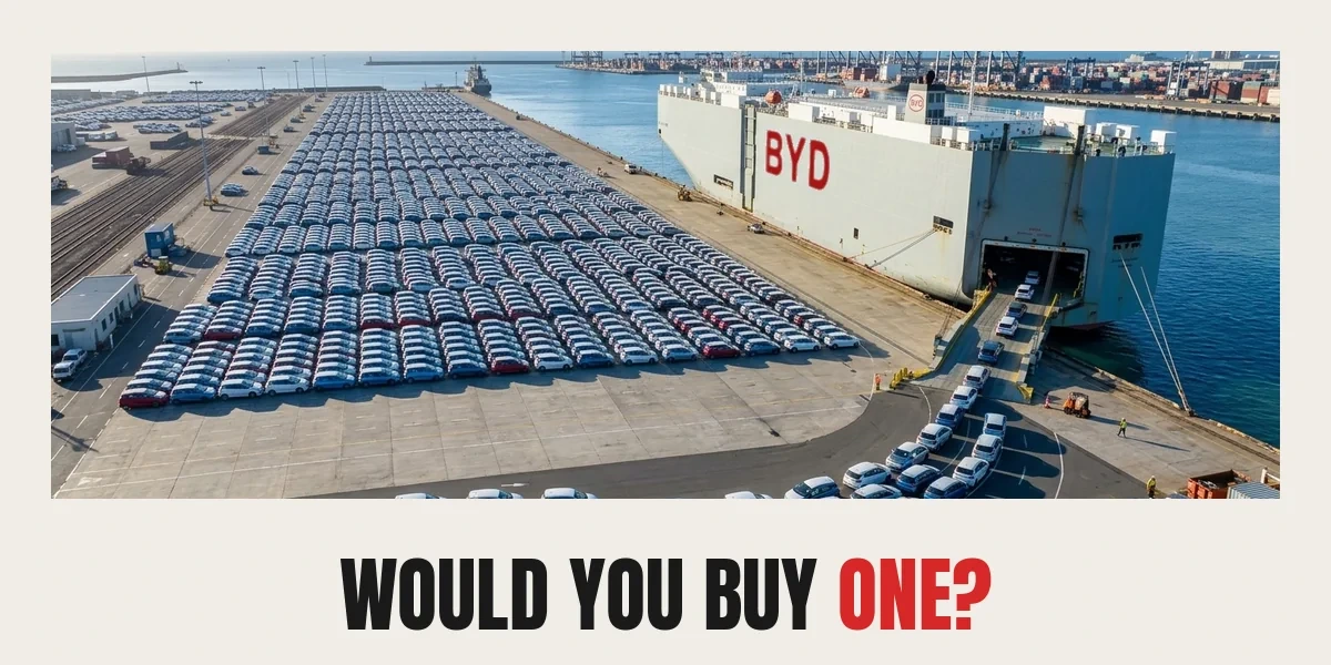 AI-generated illustration: hundreds of new electric cars in rows on a port quay, queuing up the stern ramp of a BYD car carrier ship, captioned WOULD YOU BUY ONE?